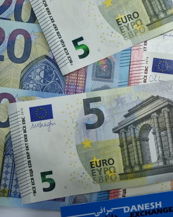Euro banknotes in 5 and 20‑euro denominations arranged together. Euro banknotes in 5 and 20‑euro denominations arranged together.
