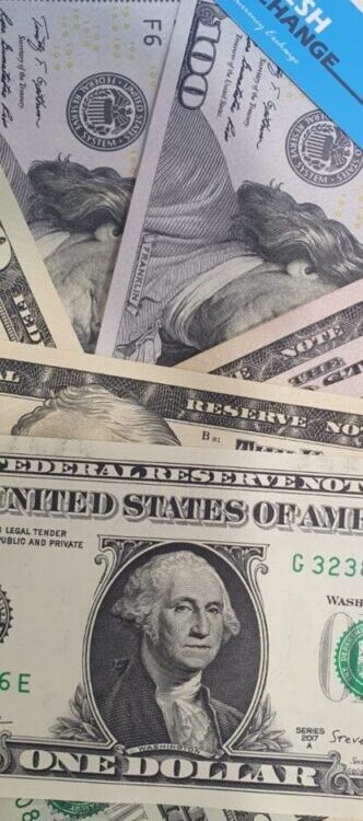 US currency mix with Benjamin Franklin $100 bills and $1 notes beside Danesh Exchange label. US currency mix with Benjamin Franklin $100 bills and $1 notes beside Danesh Exchange label.