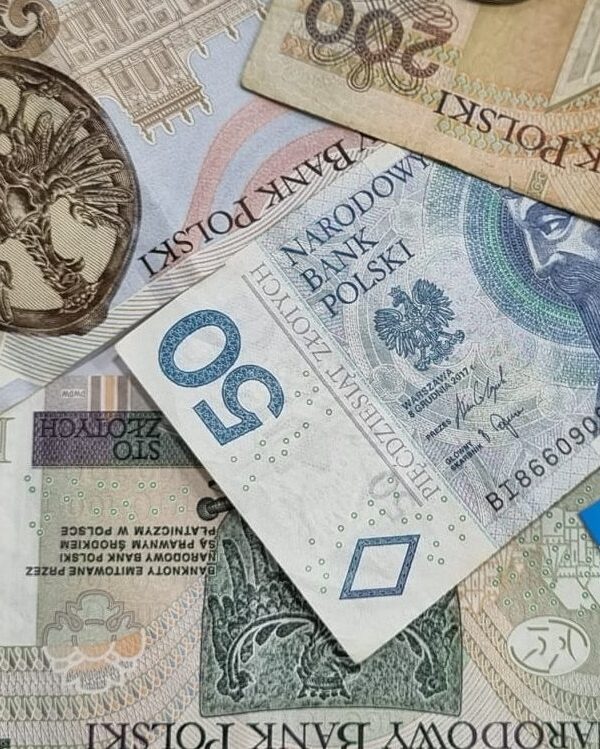 Polish złoty banknotes in 50, 100, and 200 denominations arranged together.