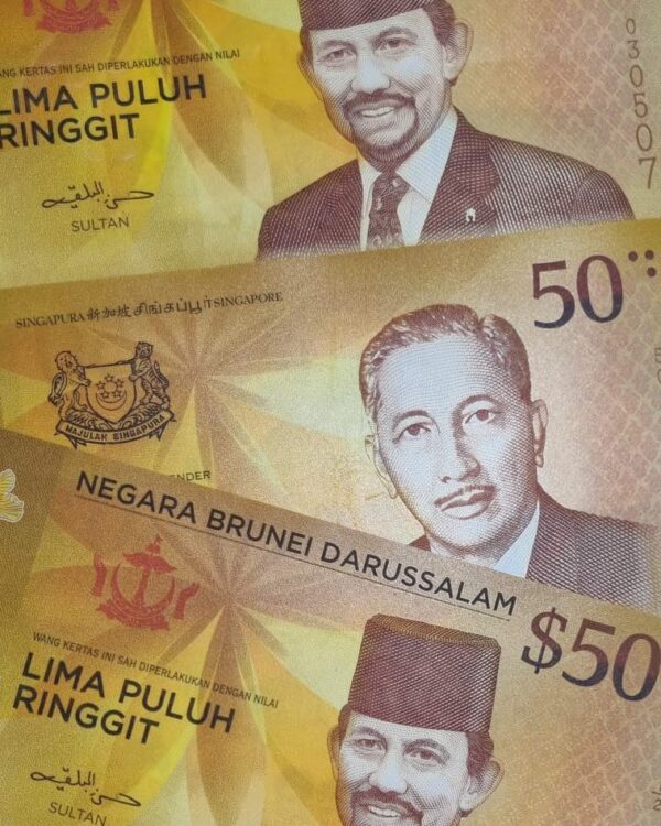 $50 Brunei and $50 Singapore dollars denominations banknotes marking Currency Interchangeability Agreement between Singapore and Brunei. $50 Brunei and $50 Singapore dollars denominations banknotes marking Currency Interchangeability Agreement between Singapore and Brunei.