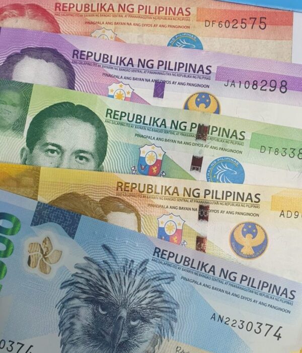 Philippine peso banknotes in 20, 50, 100, 200, and 1000 denominations arranged in a fan. Philippine peso banknotes in 20, 50, 100, 200, and 1000 denominations arranged in a fan.