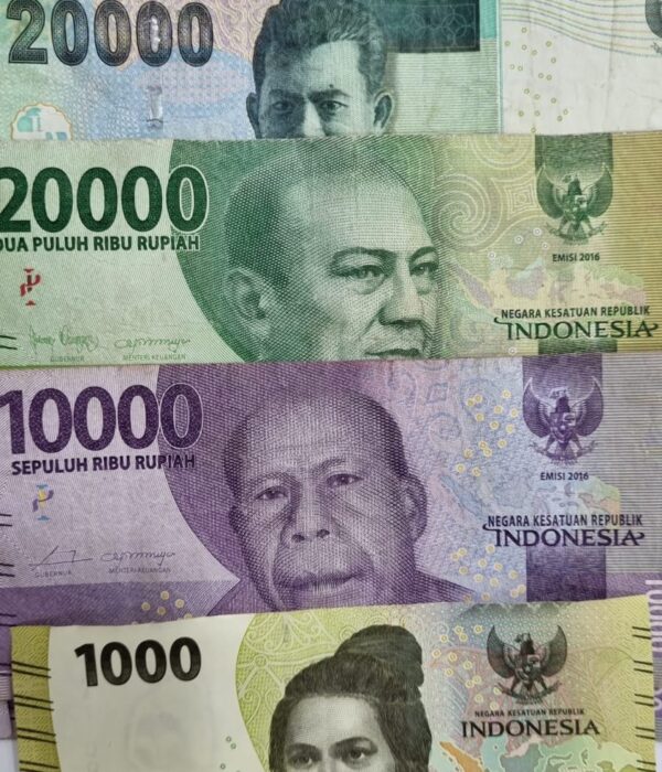 Indonesian rupiah banknotes in 1,000, 10,000, 20,000, and 50,000 denominations arranged vertically, featuring colourful portraits and designs above a blue Danesh Exchange label. Indonesian rupiah banknotes in 1,000, 10,000, 20,000, and 50,000 denominations arranged vertically, featuring colourful portraits and designs above a blue Danesh Exchange label.