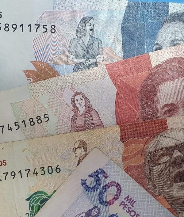 Colombian peso currency notes showing 2,000 to 50,000 denominations.