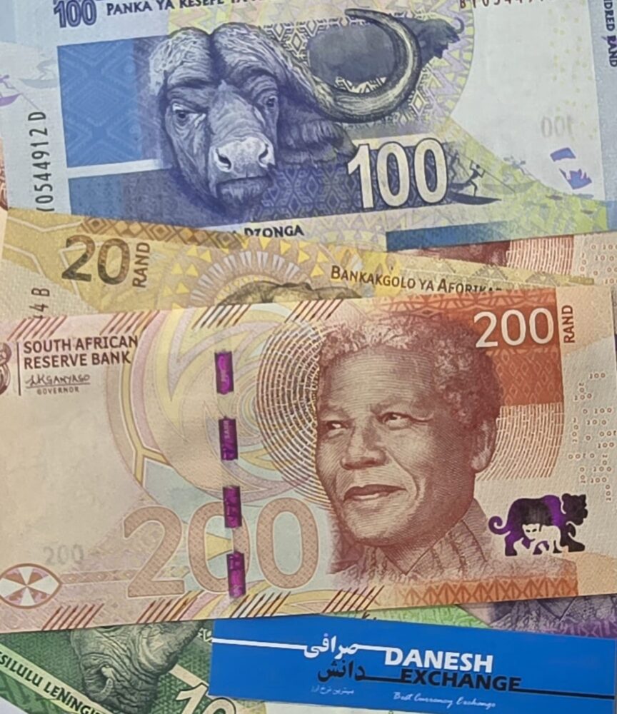 South African 100 an 200 rand banknotes placed together, showing colourful animal and portrait designs, with a blue Danesh Exchange label beneath them South African 100 an 200 rand banknotes placed together, showing colourful animal and portrait designs, with a blue Danesh Exchange label beneath them