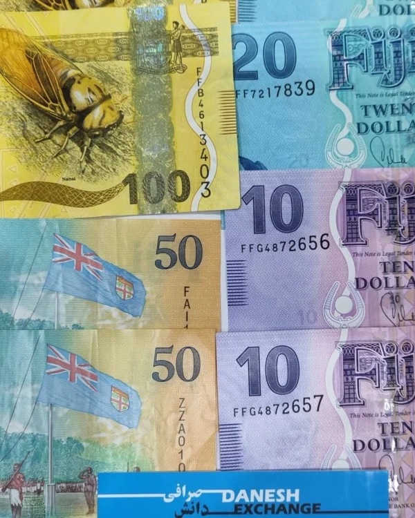 Fijian banknotes in 10, 20, 50, and 100‑dollar denominations arranged side by side. Fijian banknotes in 10, 20, 50, and 100‑dollar denominations arranged side by side.