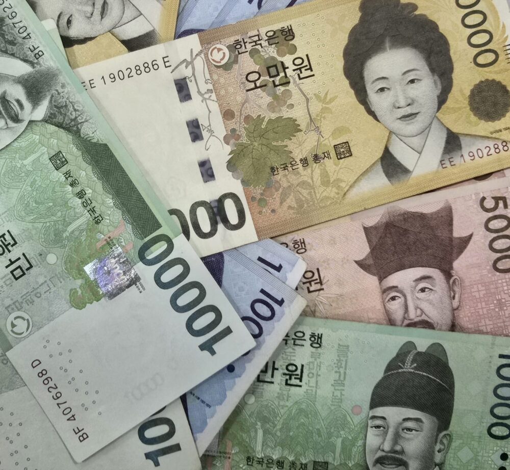 South Korean won banknotes in 1,000, 5,000, 10,000, and 50,000 denominations arranged together.